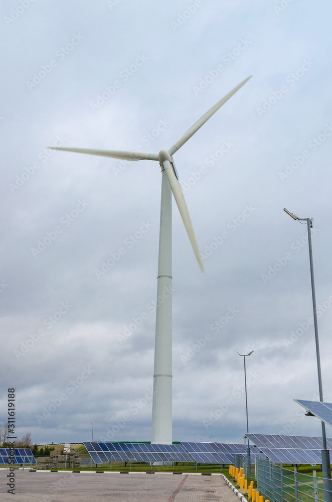 Fototapeta premium Renewable alternative clean wind energy produced by wind generators helps to preserve The earth's ecology.