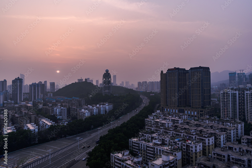 the finale of golden hour landscape over residential buildings and a meteorological radar station in shenzhen china