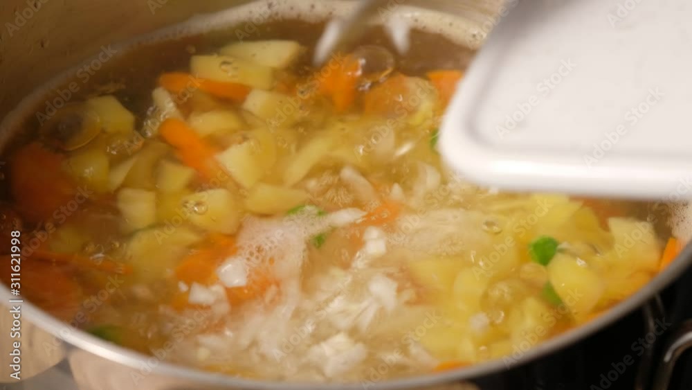 Vegetable soup. Vegetables in boiling water. Potatoes, carrots, onions, peas. Cooking vegetable soup. Vegetable soup. Vegetables in boiling water. Potatoes, carrots, onions, peas. Cooking vegetable soup.