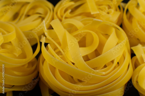 italian tagliatelle Pasta on dark background