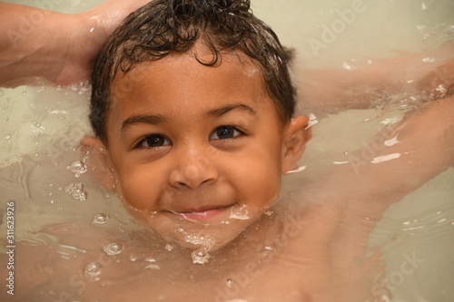 Toddler having fun at bathtime