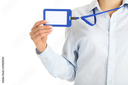 Female hand showing blank bagde on white background photo