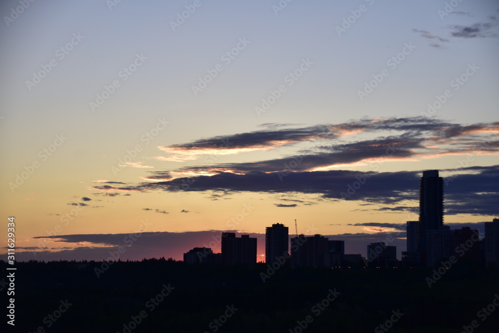 sunset over city silhouette