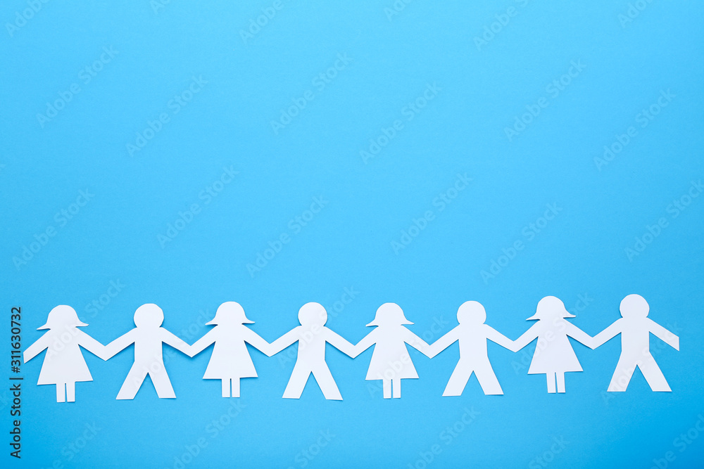 Paper chain people on yellow background Paper chain people on yellow background