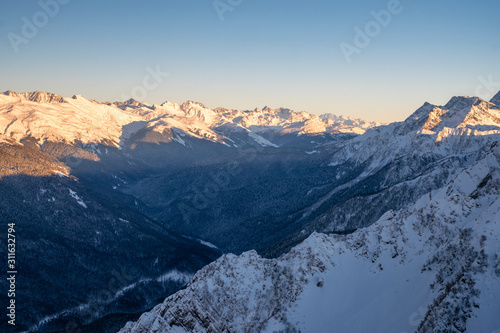 Evening in the mountains. Winter sunset in the Caucasus mountains.