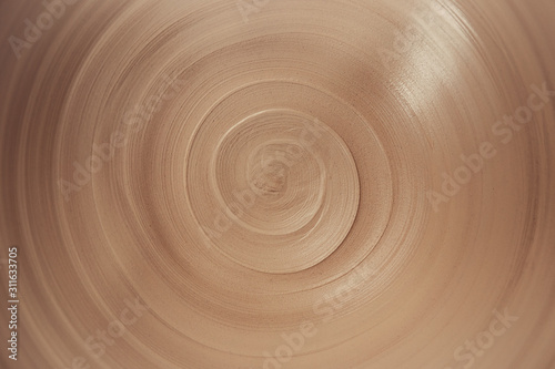 Carta da parati view of spiral lines of raw clay in the ceramic plate, abstract background of in