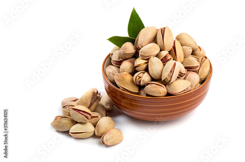 Pistachio in bowl on white background