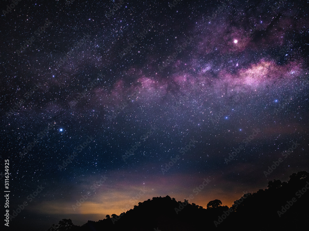 Fototapeta premium The beauty of the Milky Way Galaxy and stars on night sky before sunrise.