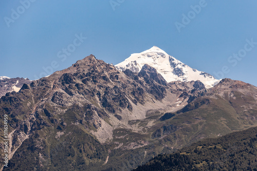 Mount Tetnuldi rises above the Great Caucasian Range in the upper Svaneti in Georgia, Mountain Landscape.