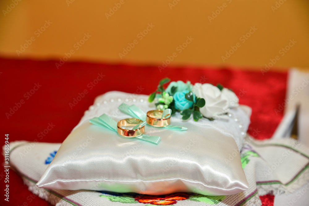 wedding rings and a beautiful bridal bouquet of flowers wedding rings and a beautiful bridal bouquet of flowers
