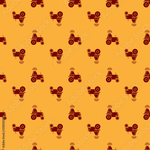 Red Self driving wireless tractor on a smart farm icon isolated seamless pattern on brown background. Smart agriculture implement element. Vector Illustration
