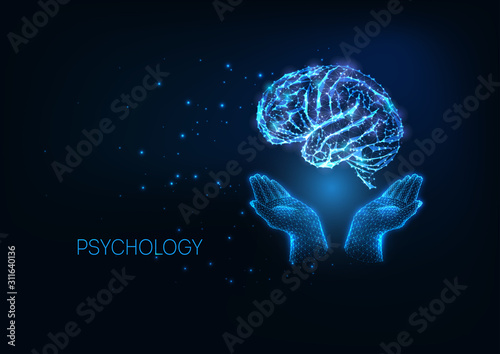 Futuristic psychology concept with glow low polygonal hands holding brain on dark blue background.