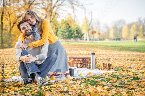 Young loving couple having a picnic outdoors