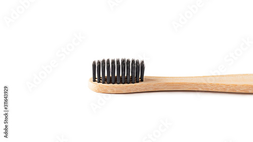 Wooden bamboo toothbrush on white background isolated. The concept of zero waste  recycling  environmental consciousness  social environmental responsibility