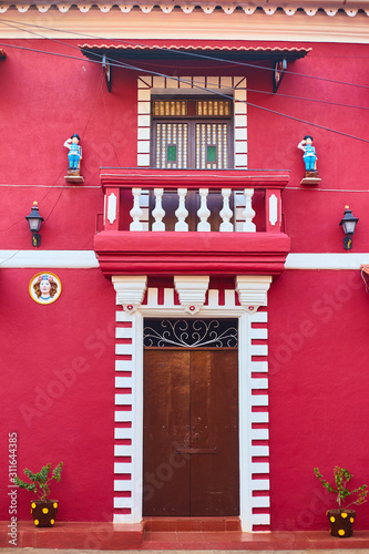 Panaji, India - December 15, 2019: A narrow lane surrounded by colorful portuguese houses in Panjim, Goa photo