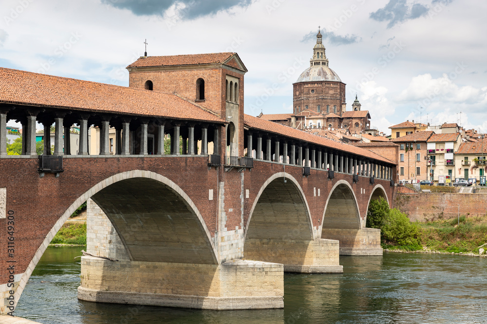 Ponte Coperto bridge over Ticino River and Cathedral of Pavia city, Lombardy, Italy
