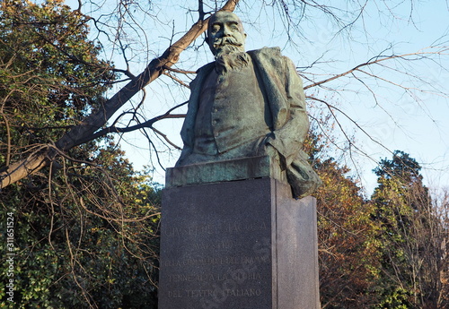 Statue of Giuseppe Giacosa in Montanelli park, Milan,  Italy. photo