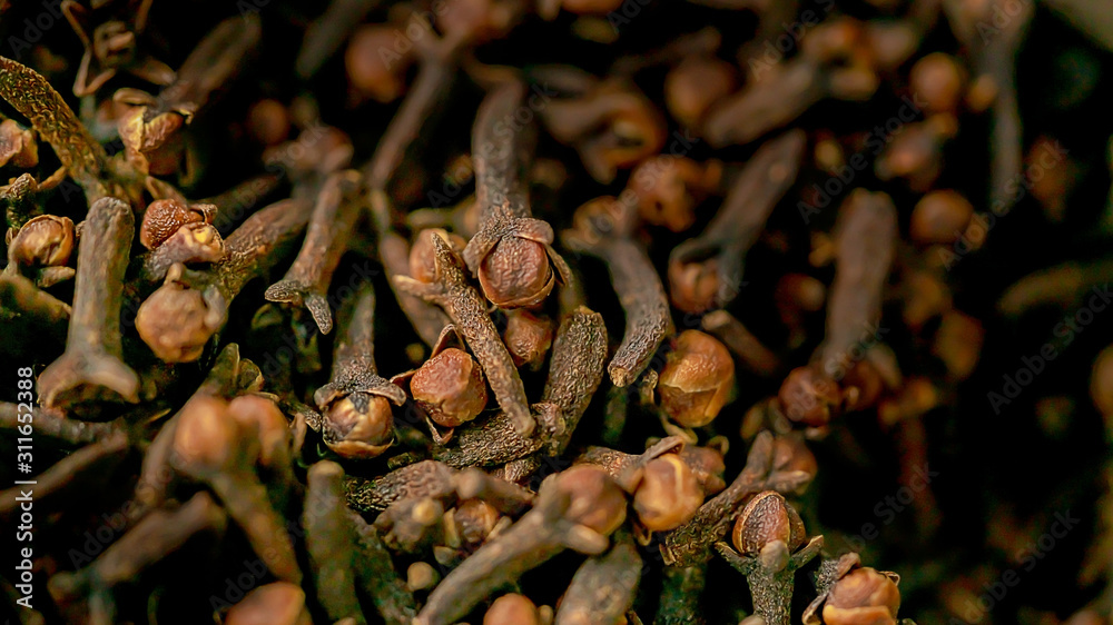 close up clove dried spicy herb for cooking and natural medicine. macro photography texture background close up clove dried spicy herb for cooking and natural medicine. macro photography texture background
