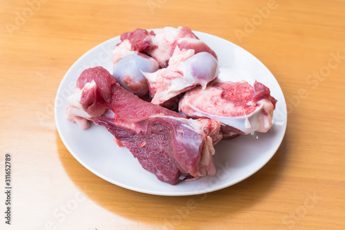 White dishes are placed on the wooden table