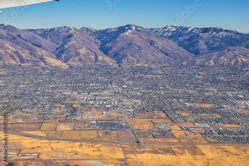 Wasatch Front Rocky Mountain Range Aerial view from airplane in fall including urban cities and the Great Salt Lake around Salt Lake City, Utah, United States of America. USA.