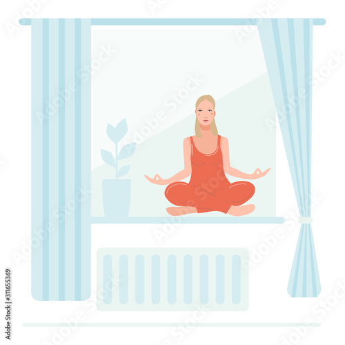 Young pretty woman sitting on the window in her room, performing yoga exercise.