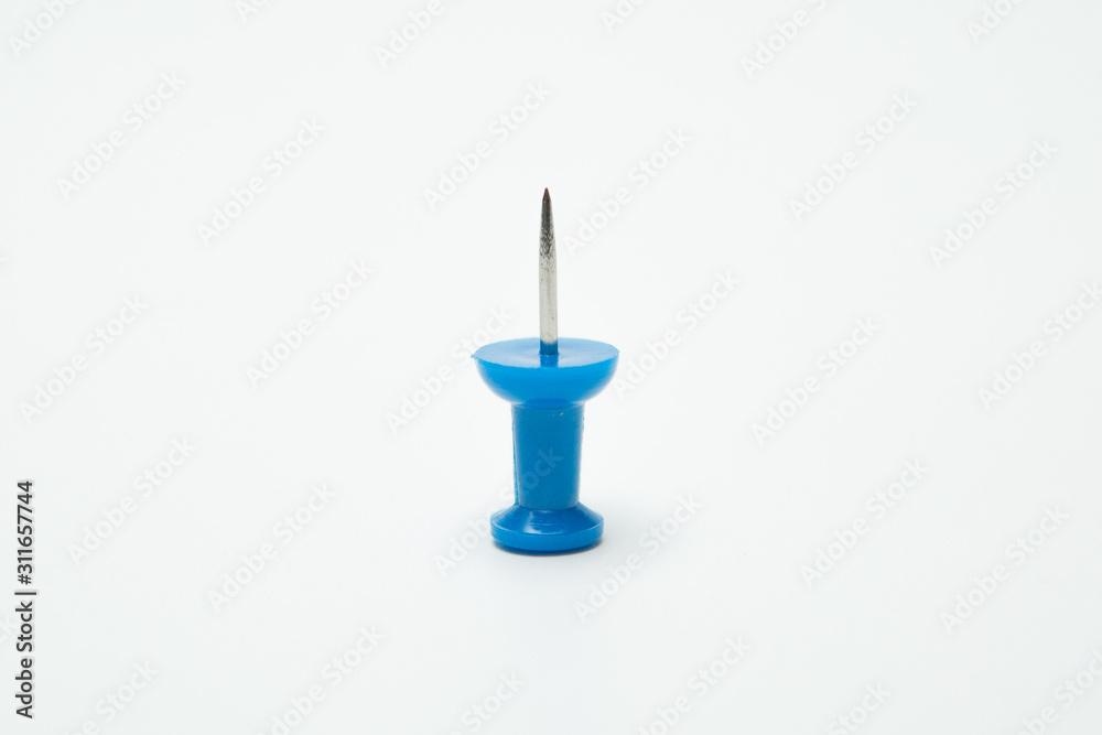 Fototapeta premium Close up of Blue pin on white background