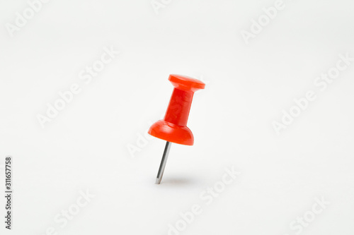Close up of Red pin  on white background