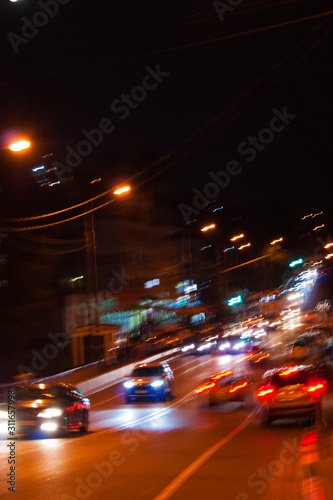 Night highway - cars drive along a narrow road. Headlights, cars, road, traffic. Subtropics, summer, heat, rest, vacation, relaxation evening night Russia Sochi - September 2019