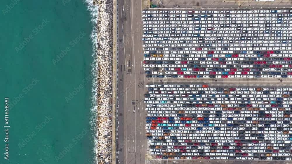 Malaga harbour with lots of vehicles parked aerial top shot Spain automotive business Malaga harbour with lots of vehicles parked aerial top shot Spain automotive business
