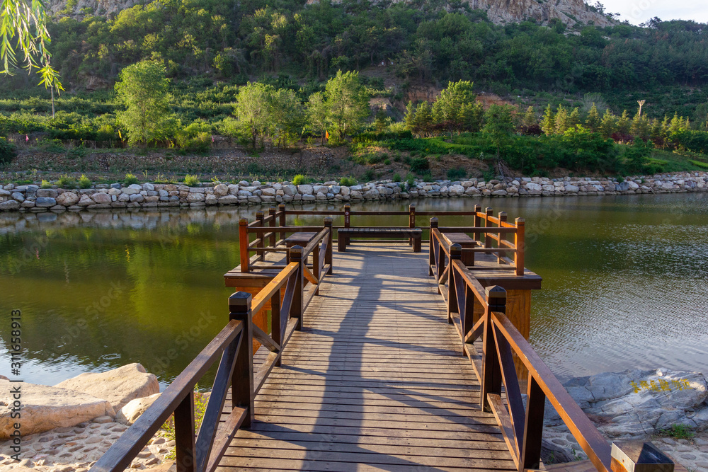 Wooden bridge in the middle of Yanshen Lake Wooden bridge in the middle of Yanshen Lake