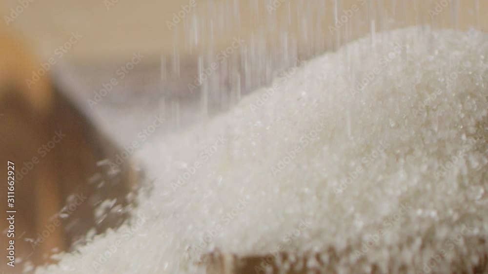 Scattering sugar on kitchen table macro shot, crystals of sugar, cooking process, slow motion, shot on Red Weapon Helium 8k Scattering sugar on kitchen table macro shot, crystals of sugar, cooking process, slow motion, shot on Red Weapon Helium 8k