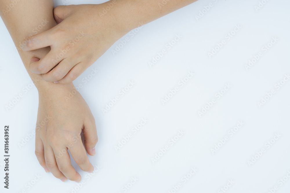 Close up woman scratching her itchy arm with allergy rash by hand on white background. Healthcare, skin problem and medical concept. Close up woman scratching her itchy arm with allergy rash by hand on white background. Healthcare, skin problem and medical concept.