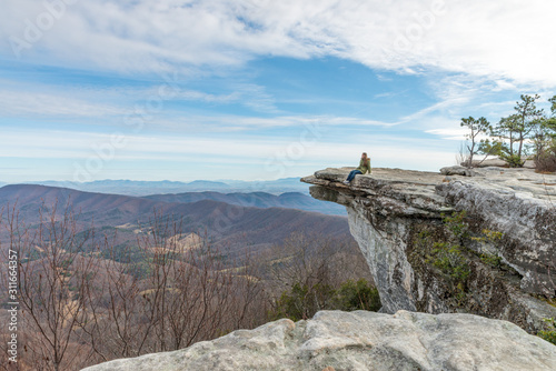 Obraz na plátně Young woman on the observation point on McAfee Knob