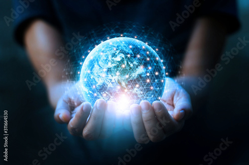 Man hands holding blue earth and global networking connection and data exchanges, global communication network concept, Elements of this image furnished by NASA. photo
