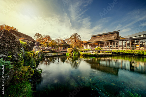 Return/ Beautiful Fuji mountain and clean lake with traditional Japanese style house in Japan photo