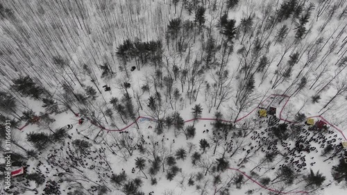 Winter party in the woods in Traverse City Michigan 4K drone shots over forest and open woods in winter snow covered scene party time in the cold photo