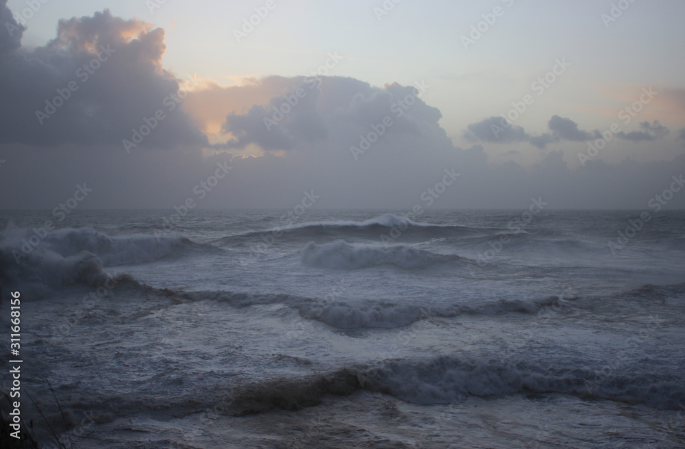 Waves in Nazare with a cloudy sunny sky Waves in Nazare with a cloudy sunny sky