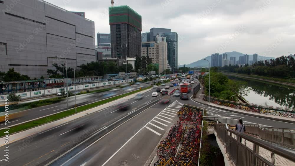 Timelapse Shenzhen highway with heavy traffic by calm river zoom out Timelapse Shenzhen highway with heavy traffic by calm river zoom out