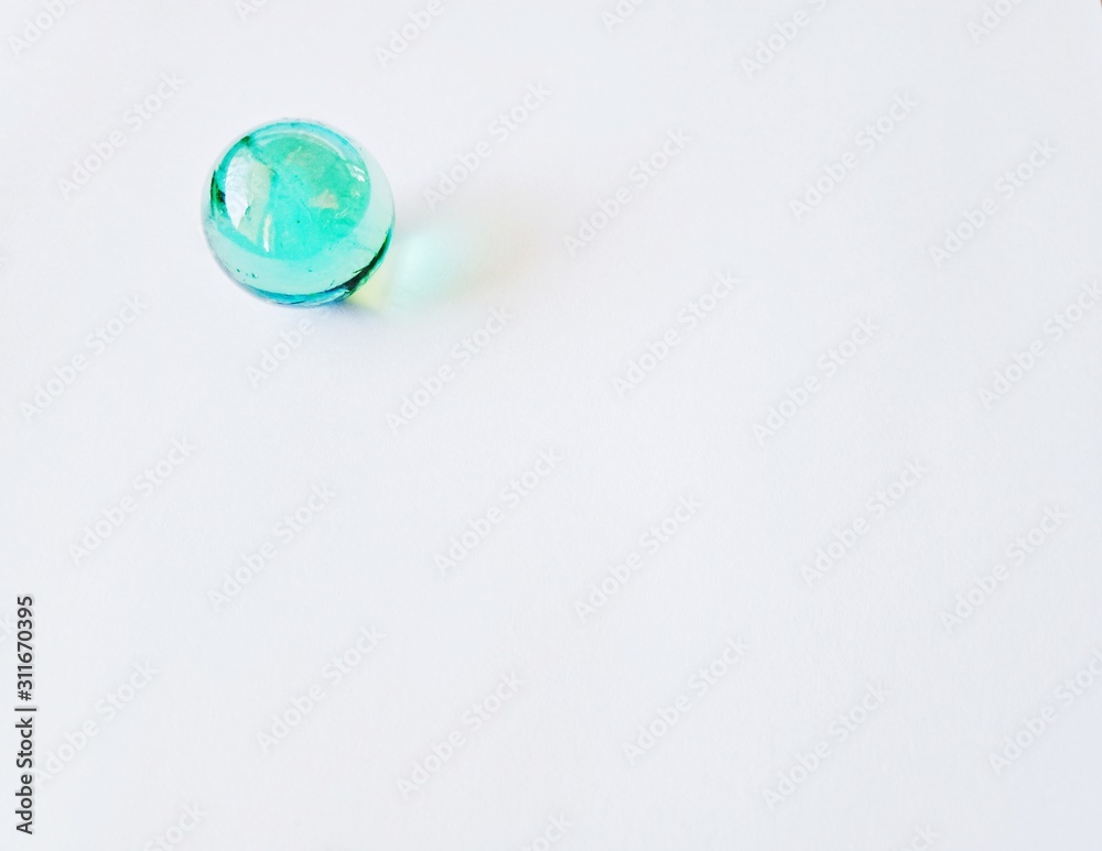 Transparent crystal ball on a paper background Transparent crystal ball on a paper background