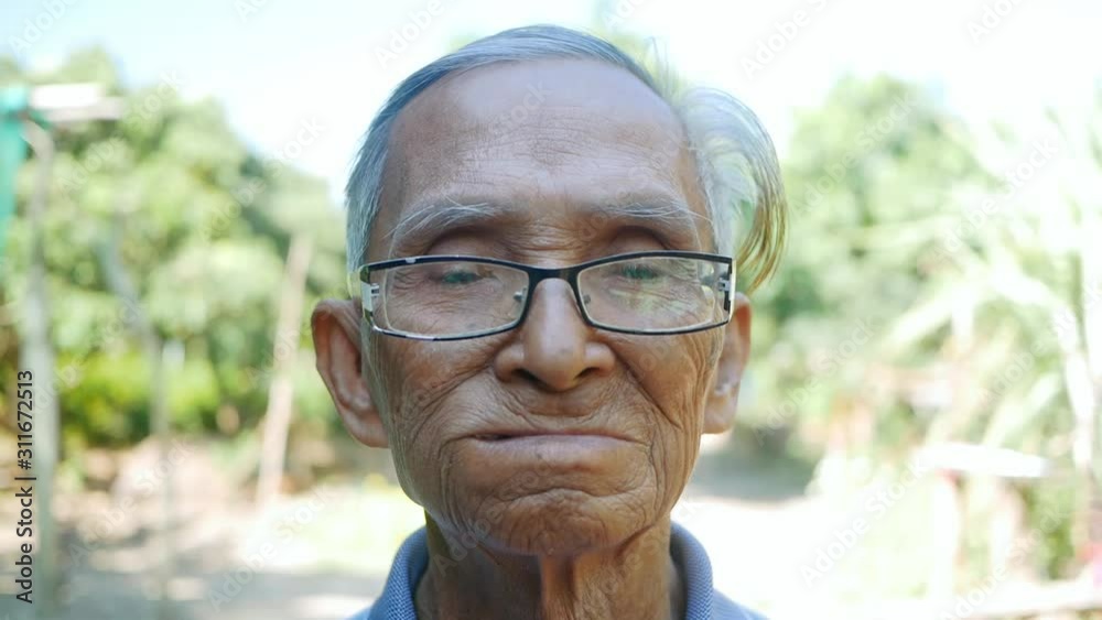 Elderly man biting on cotton gauze after tooth extraction, Tooth decay