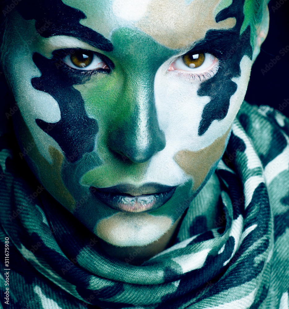 Beautiful young fashion woman with military style clothing and face paint  make-up, khaki colors, halloween celebration Stock-Foto | Adobe Stock