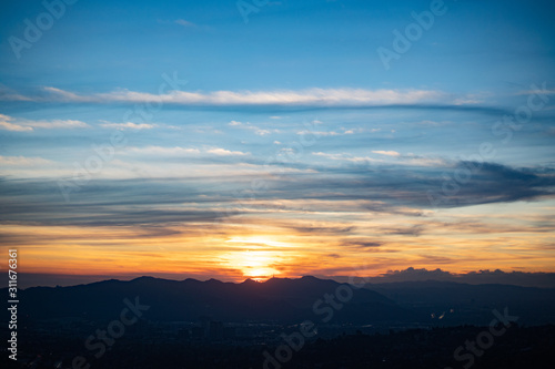 Wispy sunset of blues and oranges over Los Angeles, CA
