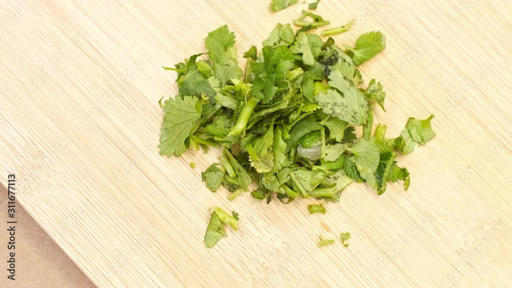 fresh cut parsley on a wooden board fresh cut parsley on a wooden board