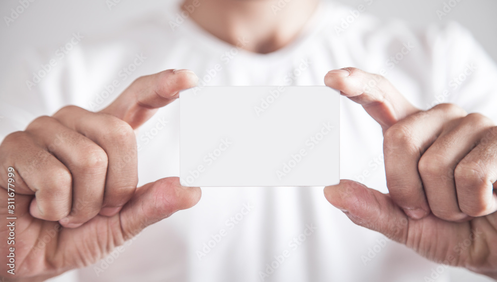 Man showing empty business card. Man showing empty business card.