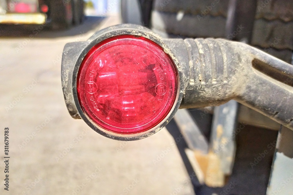 Tail lights of truck. Glowing tail lights of parked truck. Tail lights of truck. Glowing tail lights of parked truck.