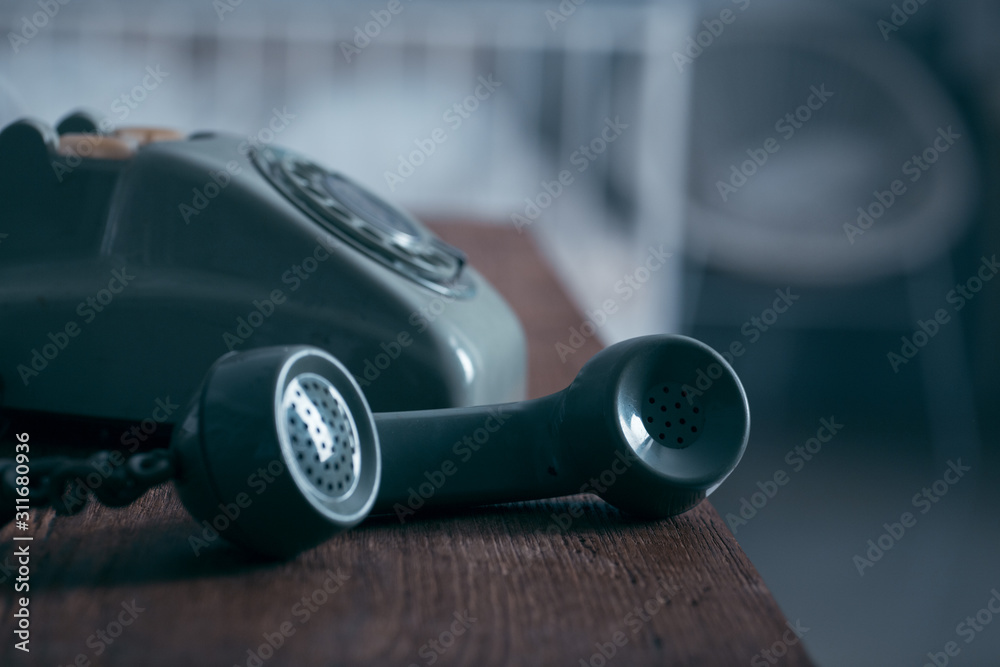 old telephone isolated on wood table for background