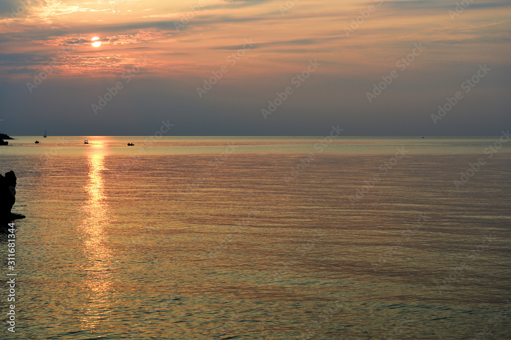 Beautiful sunrise over the Mediterranean sea in the summer. Sicily, Italy, Europe