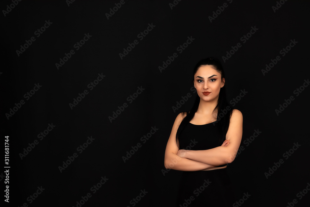 Strong looking girl doing sports on a black background Strong looking girl doing sports on a black background