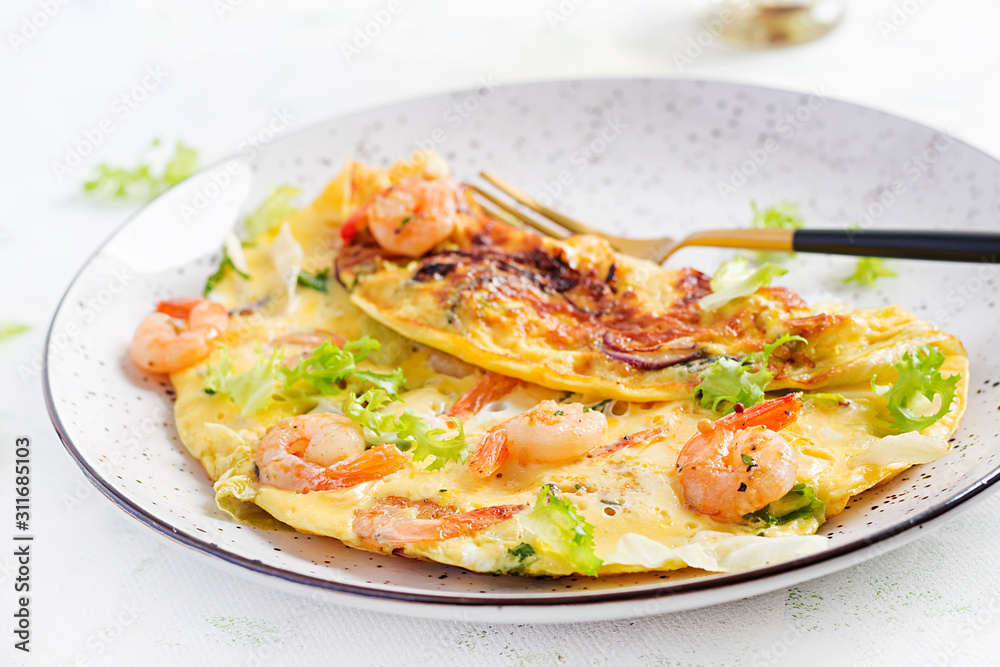 Breakfast. Ketogenic/paleo diet. Omelet with shrimp and herbs. Keto menu. Omelette. Breakfast. Ketogenic/paleo diet. Omelet with shrimp and herbs. Keto menu. Omelette.