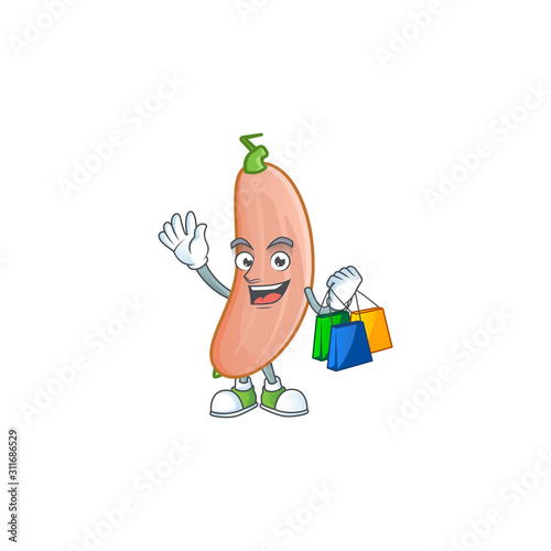 Cheerful banana squash mascot waving and holding Shopping bags